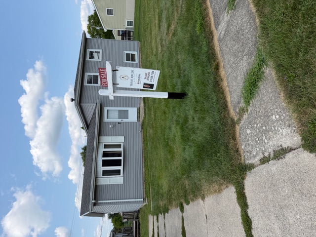 Residential real estate sign and rider installation in Lowell, Indiana