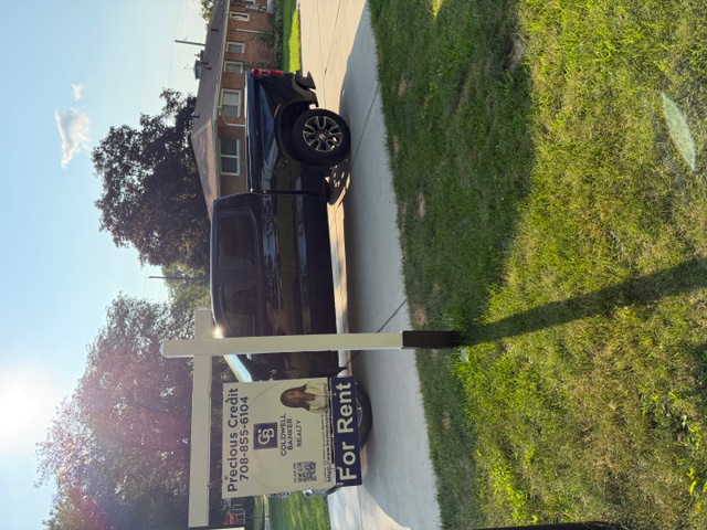 Residential real estate sign and rider installation in Munster, Indiana